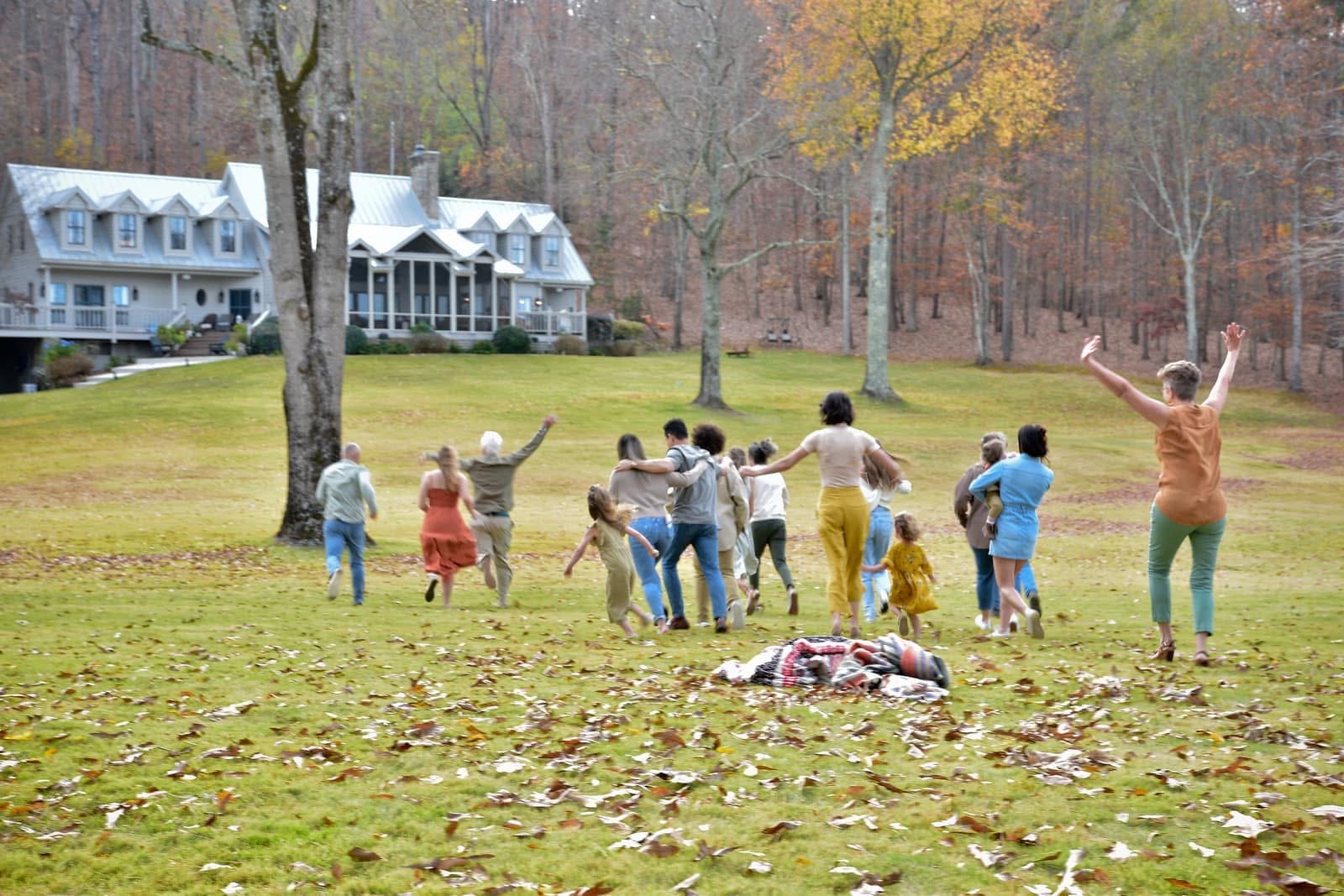 The family running together outdoors